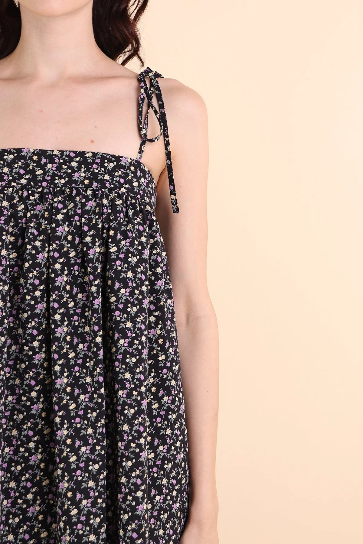 ODETTE FLORAL TRAPEZE ROMPER DRESS IN BLACK